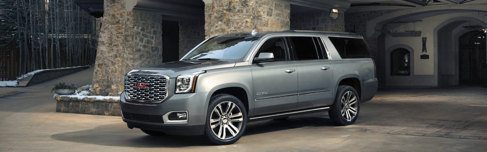 grey GMC Yukon standing parked