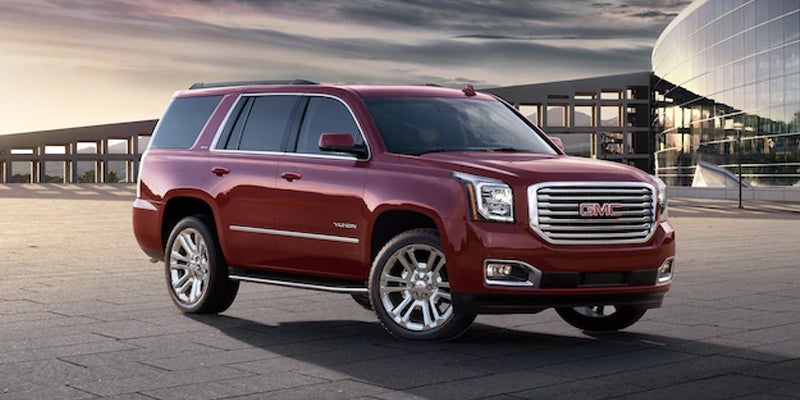 red GMC Yukon side view